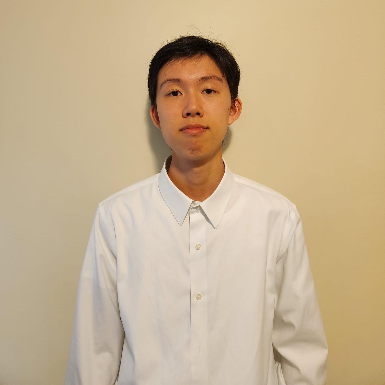 An image of Lok Tin Wong in a white collared shirt.