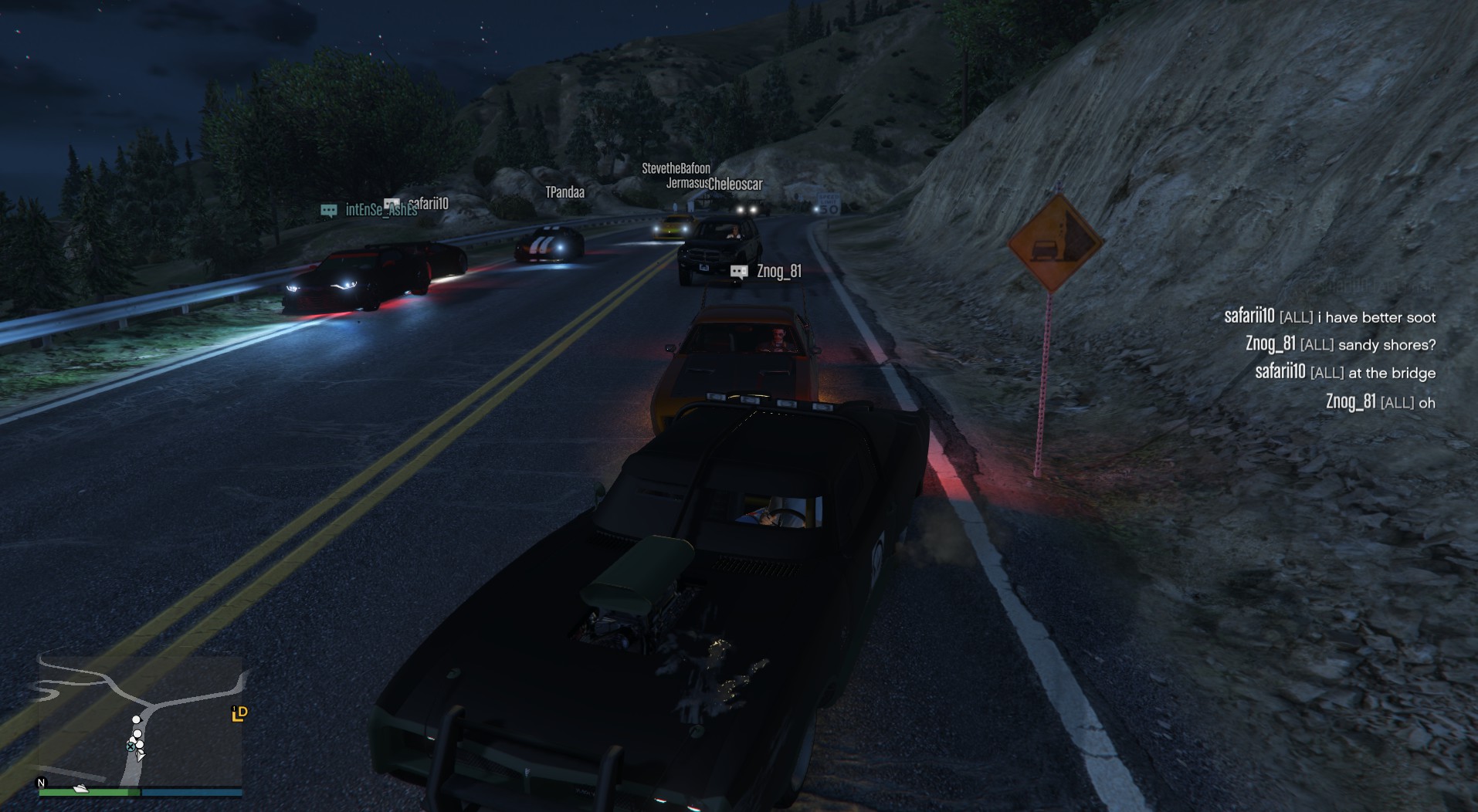 An image of sports cars and muscle cars racing down winding roads.